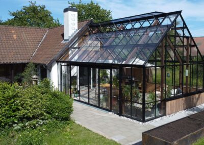 Leverum orangeri foldedør terrasse træ udestue tilbygning landejendom drivadan rasmus jensen arkitekt maa