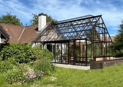 Leverum orangeri foldedør terrasse træ udestue tilbygning landejendom drivadan rasmus jensen arkitekt maa