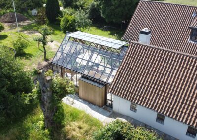Leverum orangeri foldedør terrasse træ udestue tilbygning landejendom drivadan rasmus jensen arkitekt maa